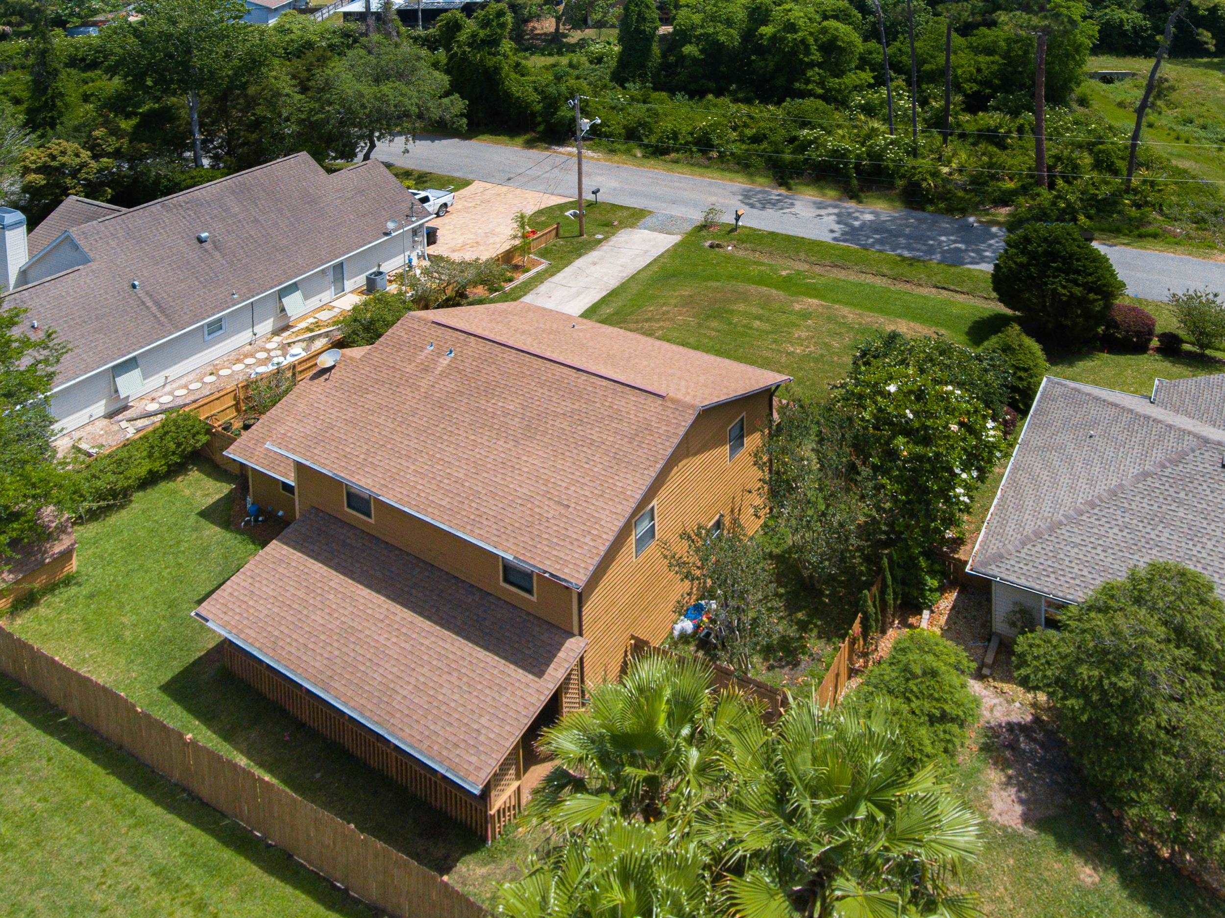 110 Harvard Road St. Augustine, FL 32086 - Photo 5 of 42 an aerial view of a house with swimming pool and outdoor seating