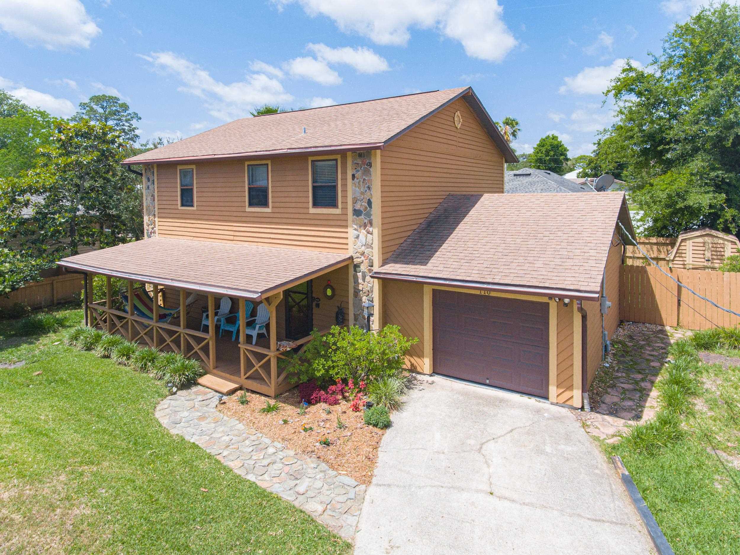 110 Harvard Road St. Augustine, FL 32086 - Photo 10 of 42 a aerial view of a house with a yard and potted plants