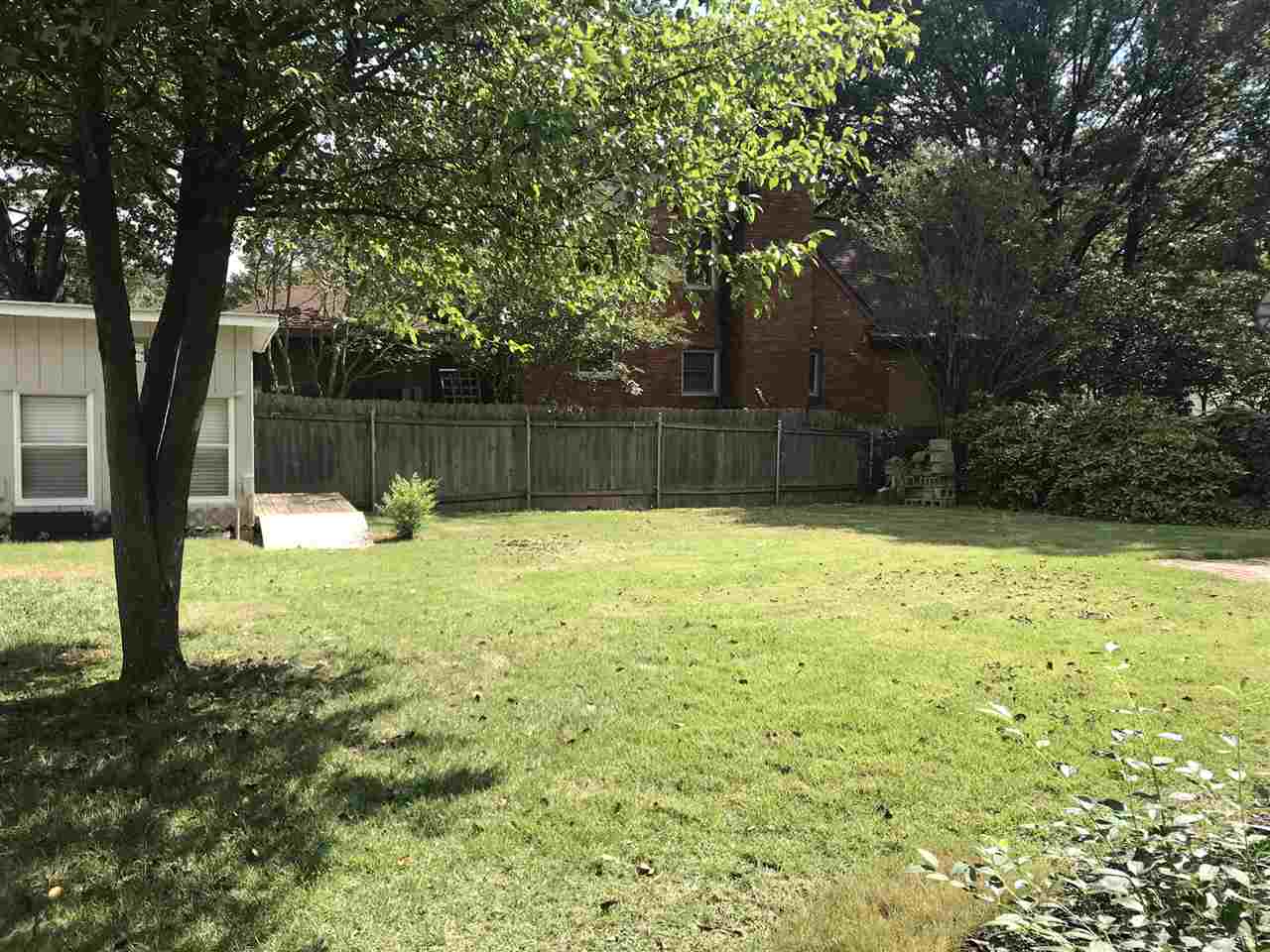 6188 Ivanhoe Road Bartlett, TN 38134 - Photo 23 of 25 Storage shed has electricity and yard has new sod where old building was removed.