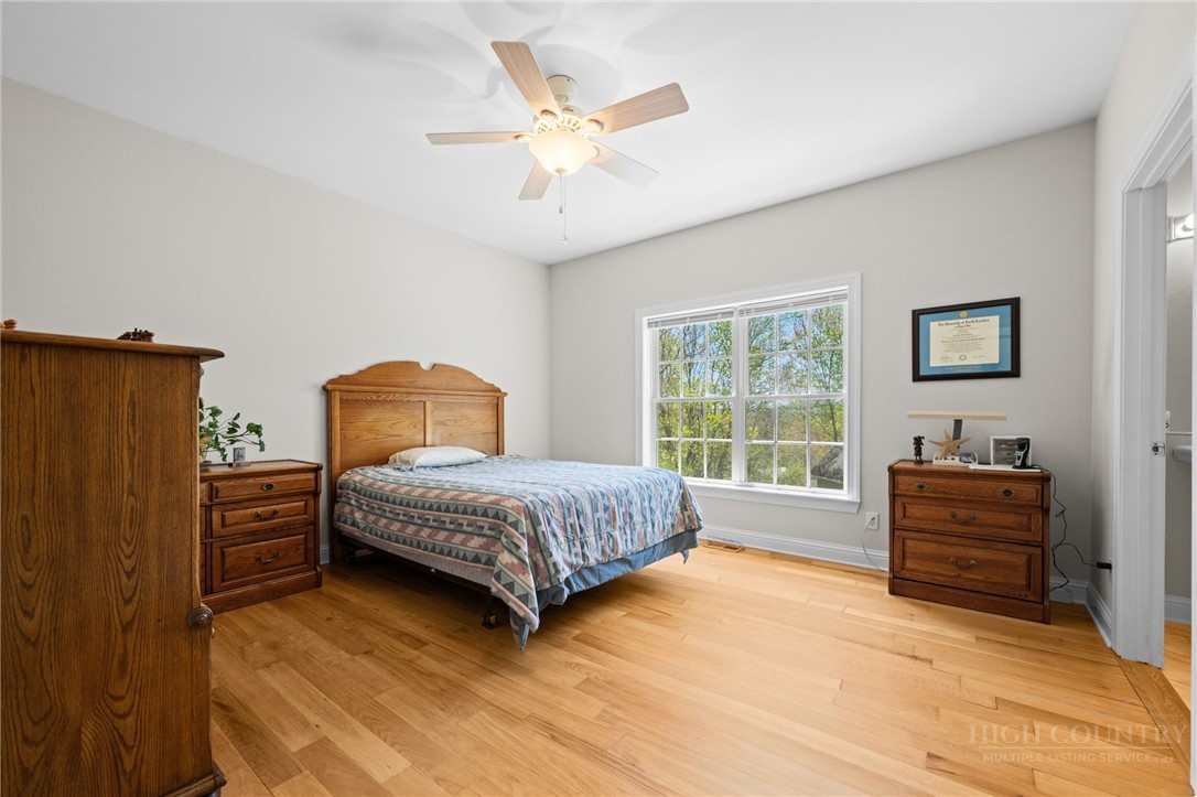 982 Brown's Chapel Road Boone, NC 28607 - Photo 12 of 42 a bedroom with a bed and a window