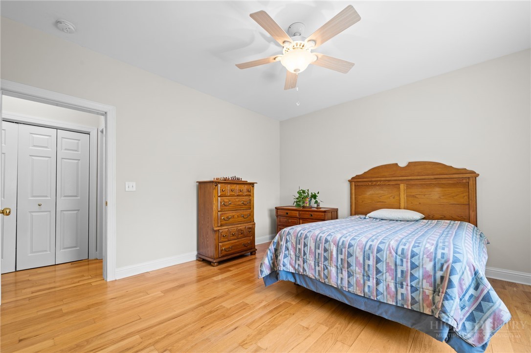 982 Brown's Chapel Road Boone, NC 28607 - Photo 13 of 42 a bedroom with a bed and a chandelier