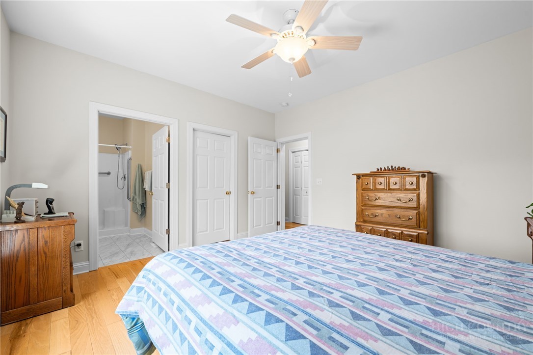 982 Brown's Chapel Road Boone, NC 28607 - Photo 14 of 42 a bedroom with a bed and a chandelier