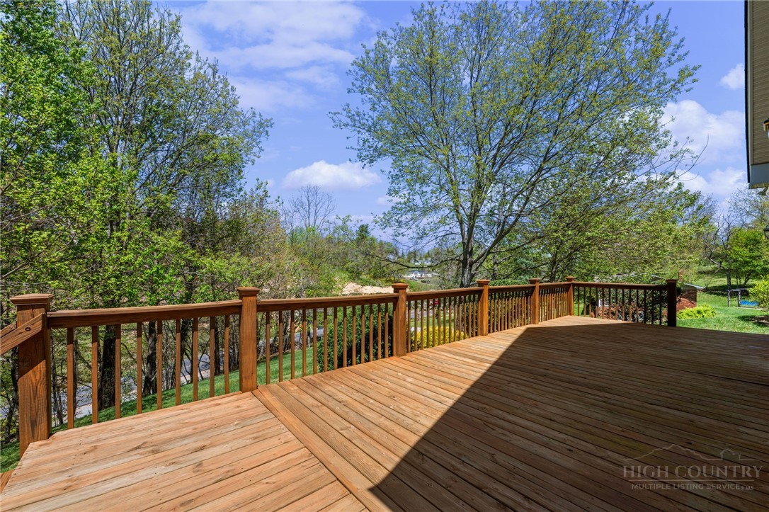 982 Brown's Chapel Road Boone, NC 28607 - Photo 35 of 42 a balcony with wooden floor and fence