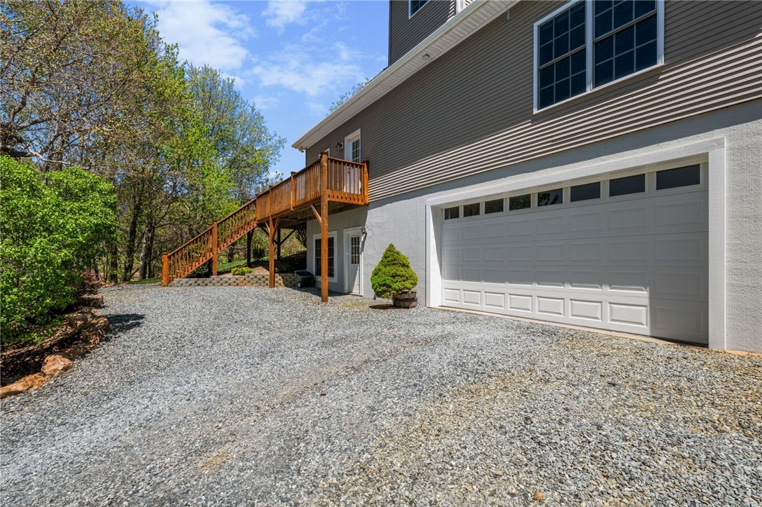 982 Brown's Chapel Road Boone, NC 28607 - Photo 40 of 42 a view of a house with a yard and garage