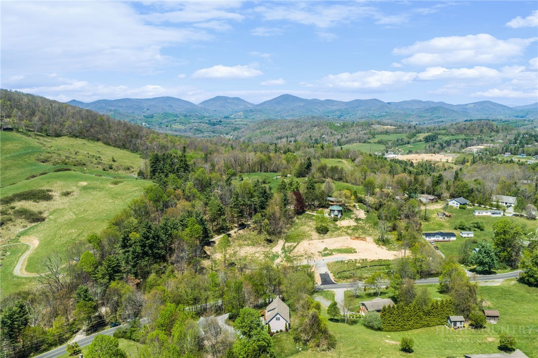 982 Brown's Chapel Road Boone, NC 28607 - Photo 42 of 42 a view of a lush green hillside and houses