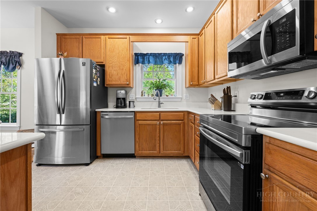 982 Brown's Chapel Road Boone, NC 28607 - Photo 9 of 42 a kitchen with a refrigerator sink and stove