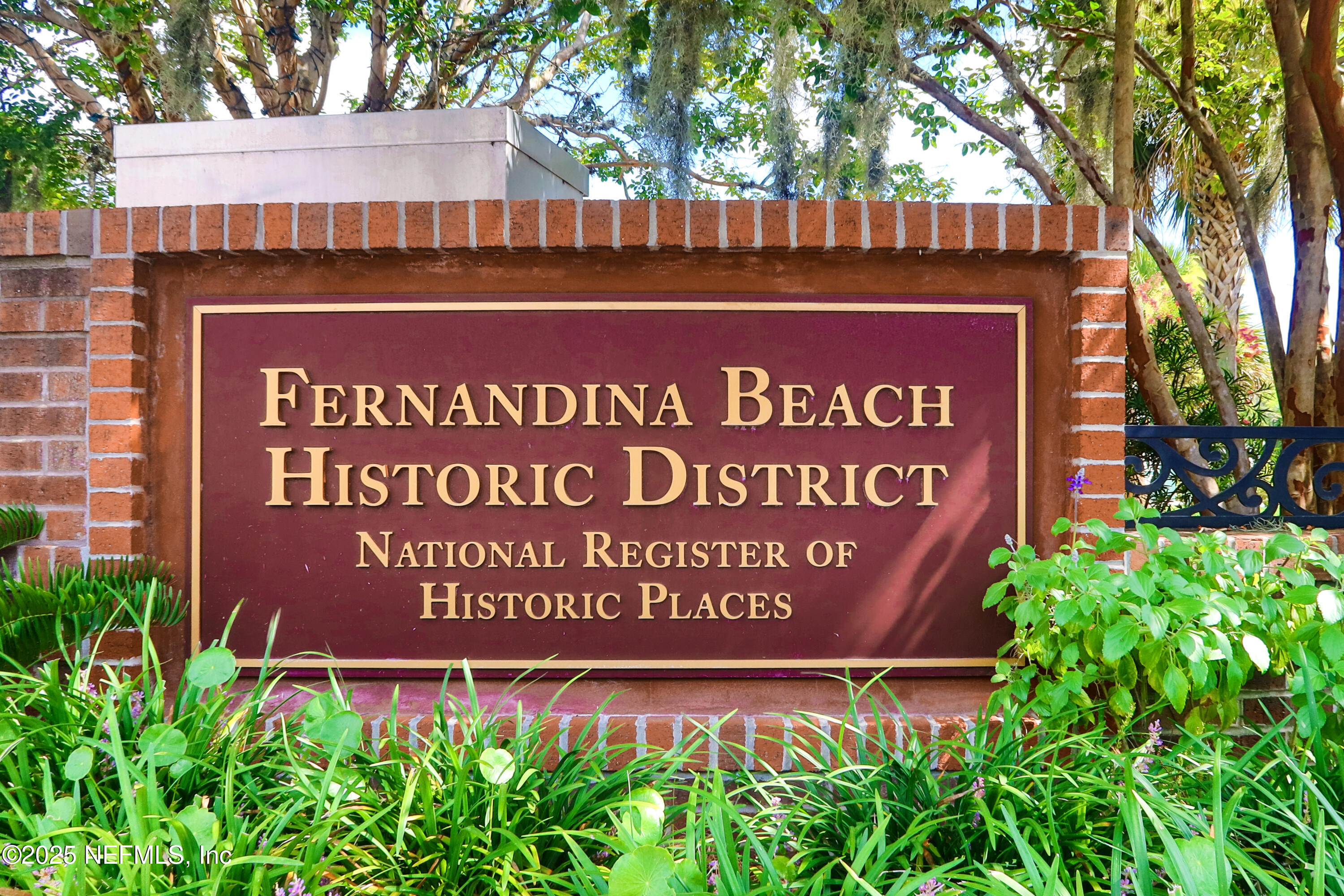 903 Someruelus Street Fernandina Beach, FL 32034 - Photo 13 of 23 a sign on the side of a building