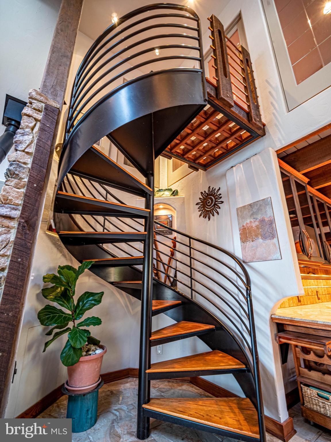 4610 Friendship Acres Road Nanjemoy, MD 20662 - Photo 20 of 84 72" dia black steel staircase w/ oak treads