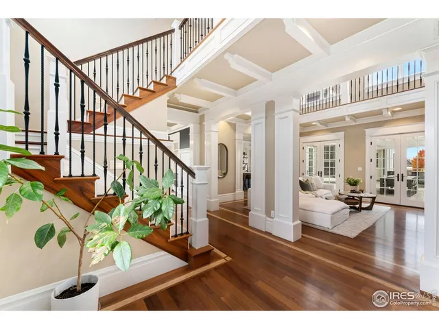 a view of living room and dining room with wooden floor