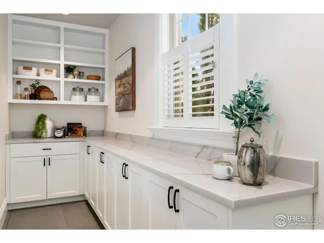 a kitchen with sink and cabinets