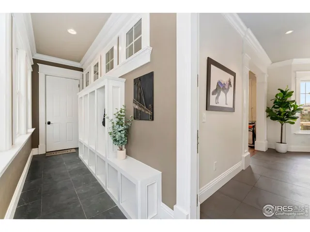 a view interior of a house and an entryway with wooden floor