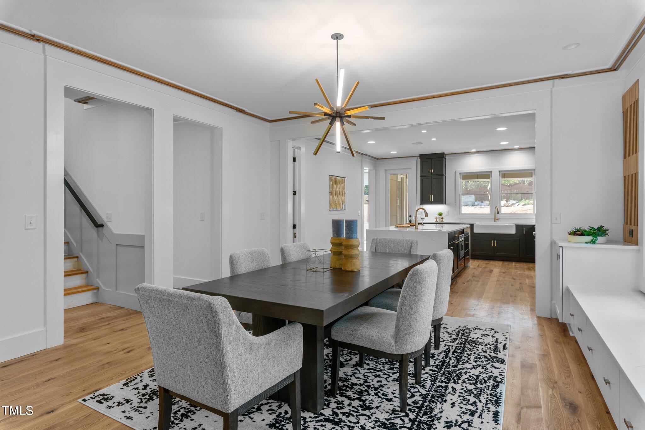 1435 Nottingham Road Raleigh, NC 27607 - Photo 13 of 48 a dining room with furniture and wooden floor