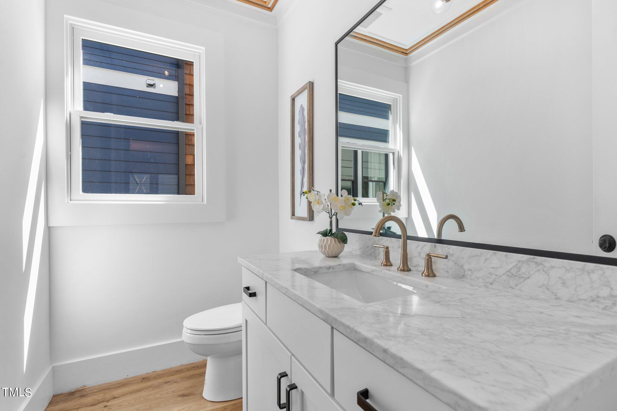 1435 Nottingham Road Raleigh, NC 27607 - Photo 14 of 48 a bathroom with a granite countertop sink mirror vanity and toilet