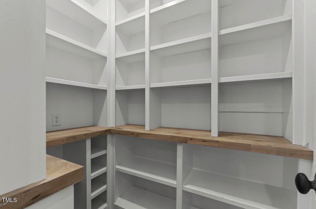 1435 Nottingham Road Raleigh, NC 27607 - Photo 18 of 48 a view of walk in closet with empty racks