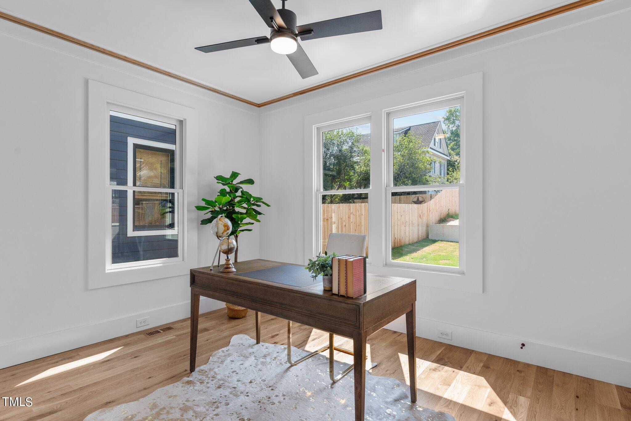 1435 Nottingham Road Raleigh, NC 27607 - Photo 20 of 48 a workspace with furniture and a potted plant