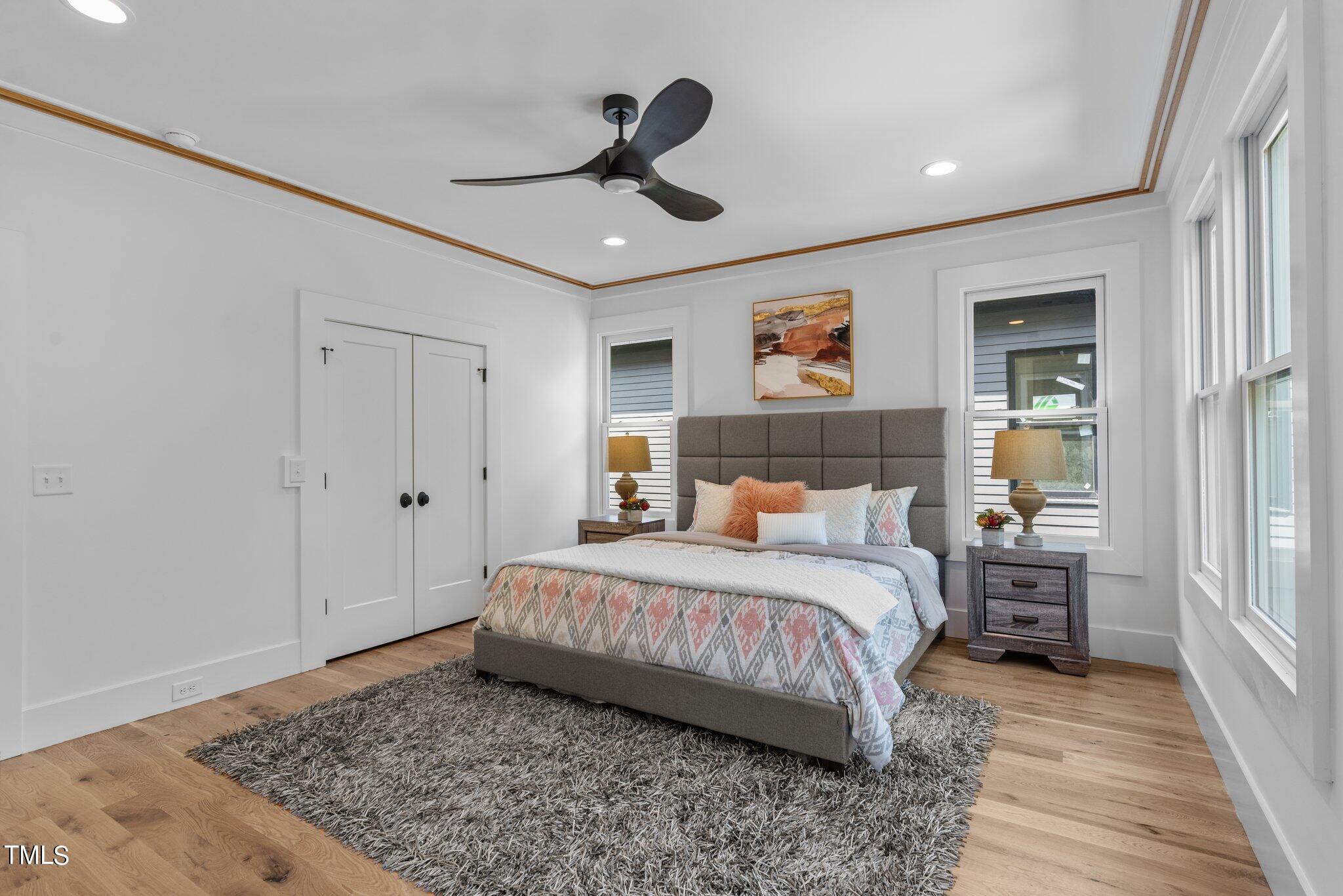 1435 Nottingham Road Raleigh, NC 27607 - Photo 22 of 48 a bedroom with a bed and wooden floor