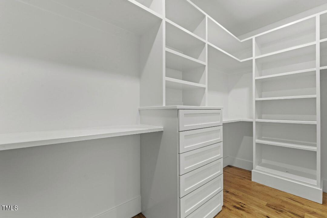 1435 Nottingham Road Raleigh, NC 27607 - Photo 26 of 48 a view of walk in closet with empty racks