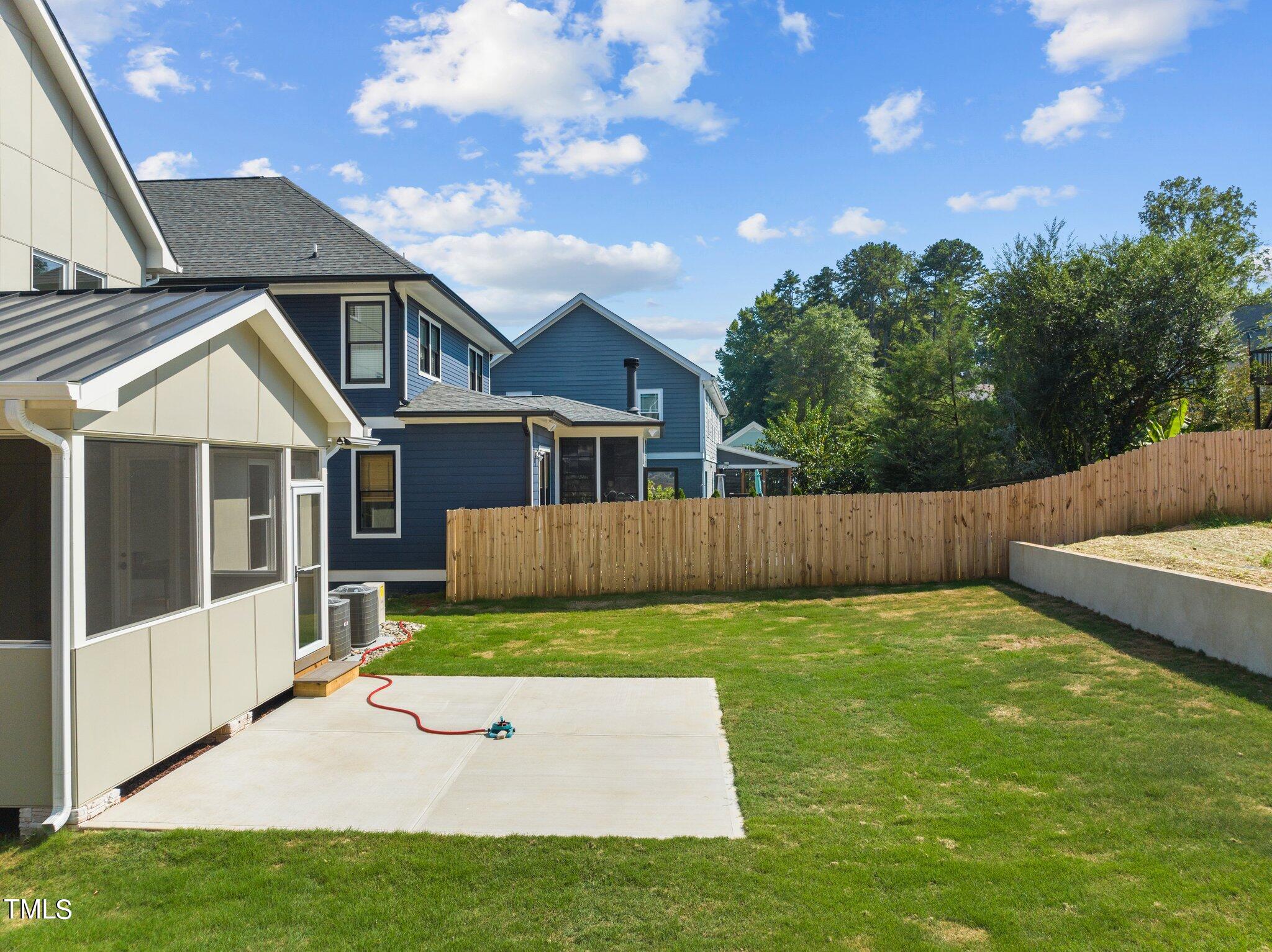 1435 Nottingham Road Raleigh, NC 27607 - Photo 34 of 48 a view of a house with a yard potted plants and wooden fence