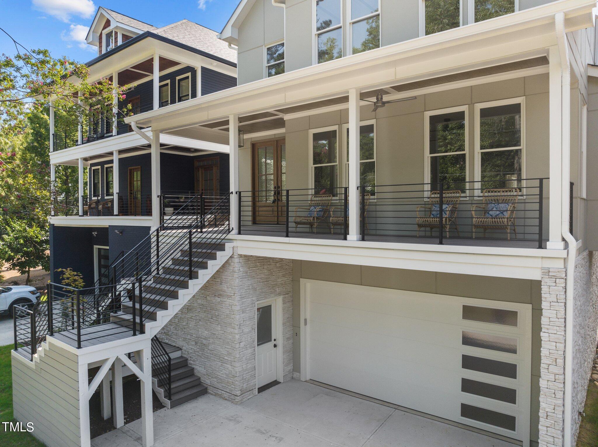 1435 Nottingham Road Raleigh, NC 27607 - Photo 4 of 48 a view of a white house with large windows