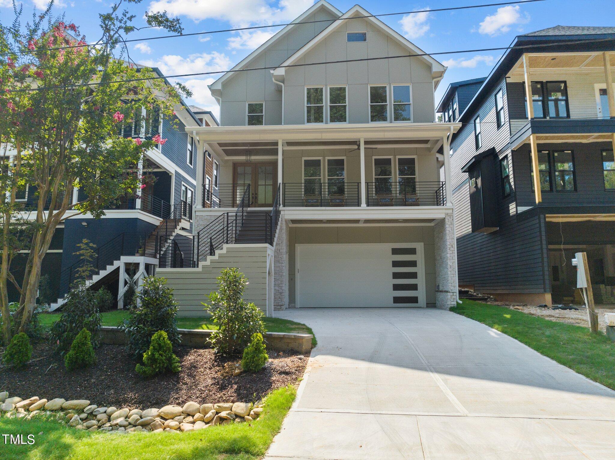1435 Nottingham Road Raleigh, NC 27607 - Photo 47 of 48 a front view of a house with a yard and garage