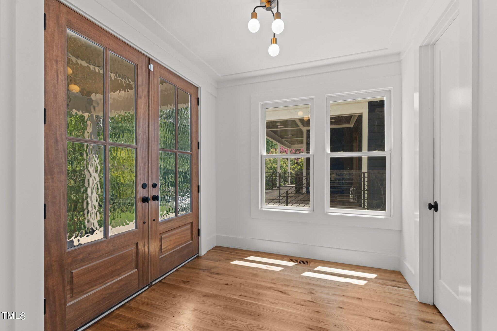 1435 Nottingham Road Raleigh, NC 27607 - Photo 8 of 48 a view of an empty room with a window