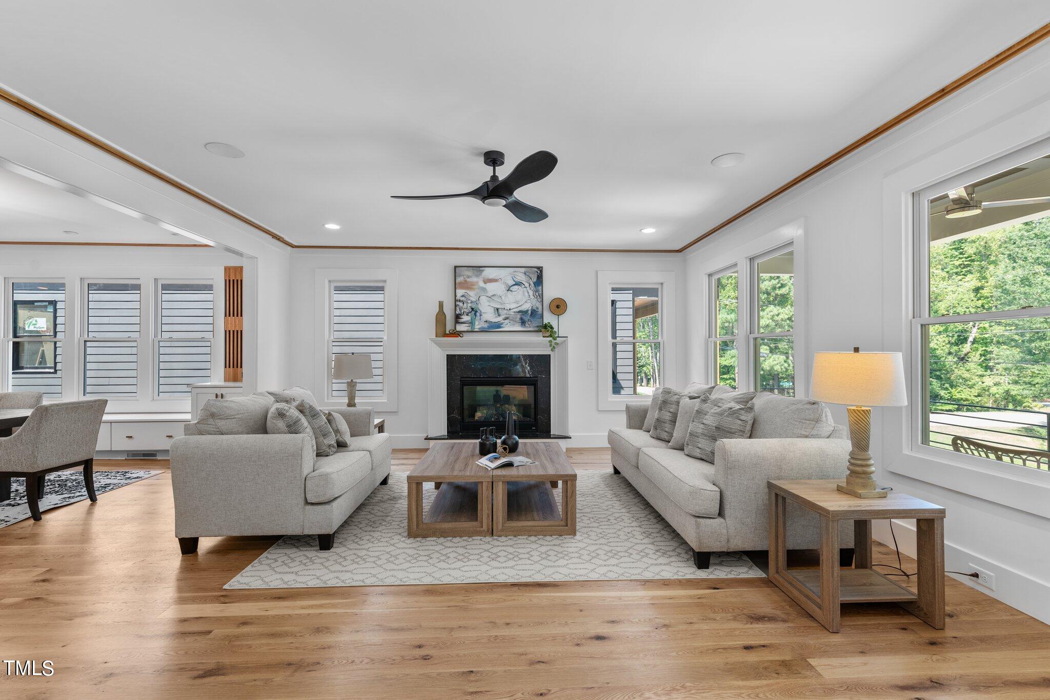1435 Nottingham Road Raleigh, NC 27607 - Photo 9 of 48 a living room with furniture and a fireplace