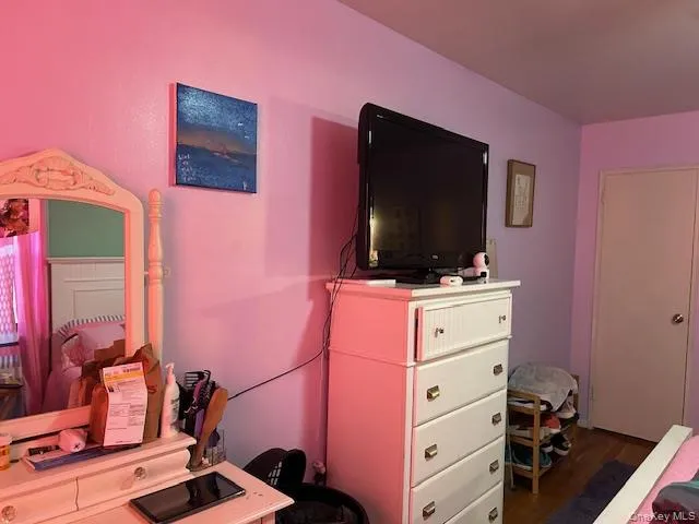 a bedroom with a bed and a closet