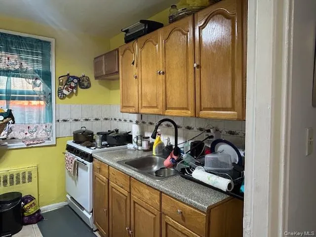a room with a refrigerator and washer