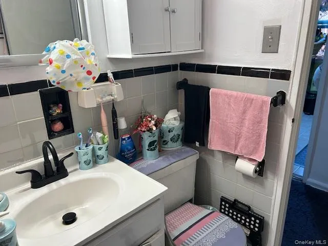 a en suite bathroom with a sink and a mirror