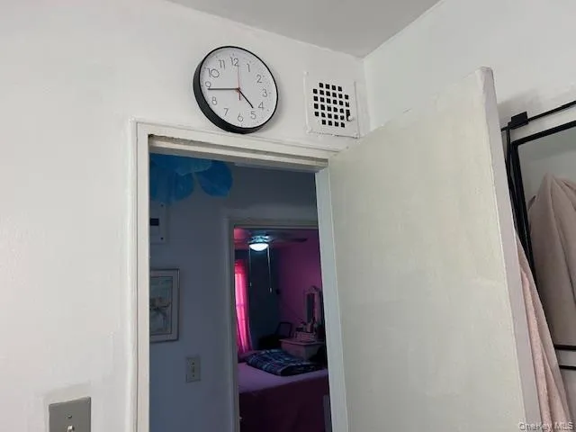 a dining room with furniture and a chandelier