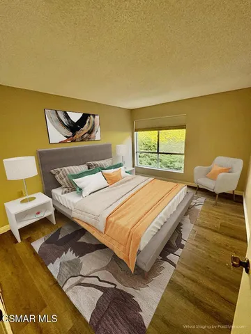 a bedroom with a bed and window