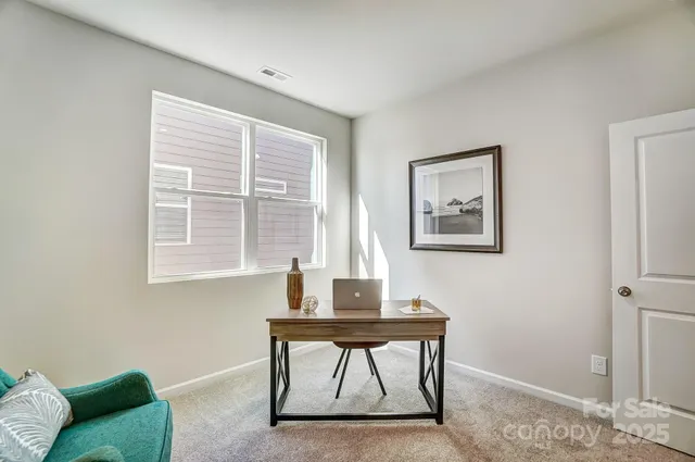 a workspace with furniture and window