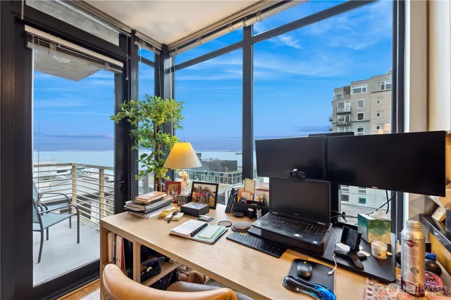 a workspace with furniture and window