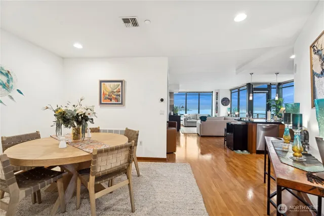 a spacious bedroom with a bed and a flat screen tv