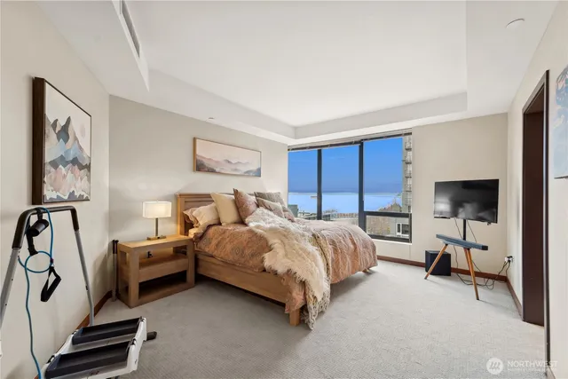 a bed room with a bed and a window