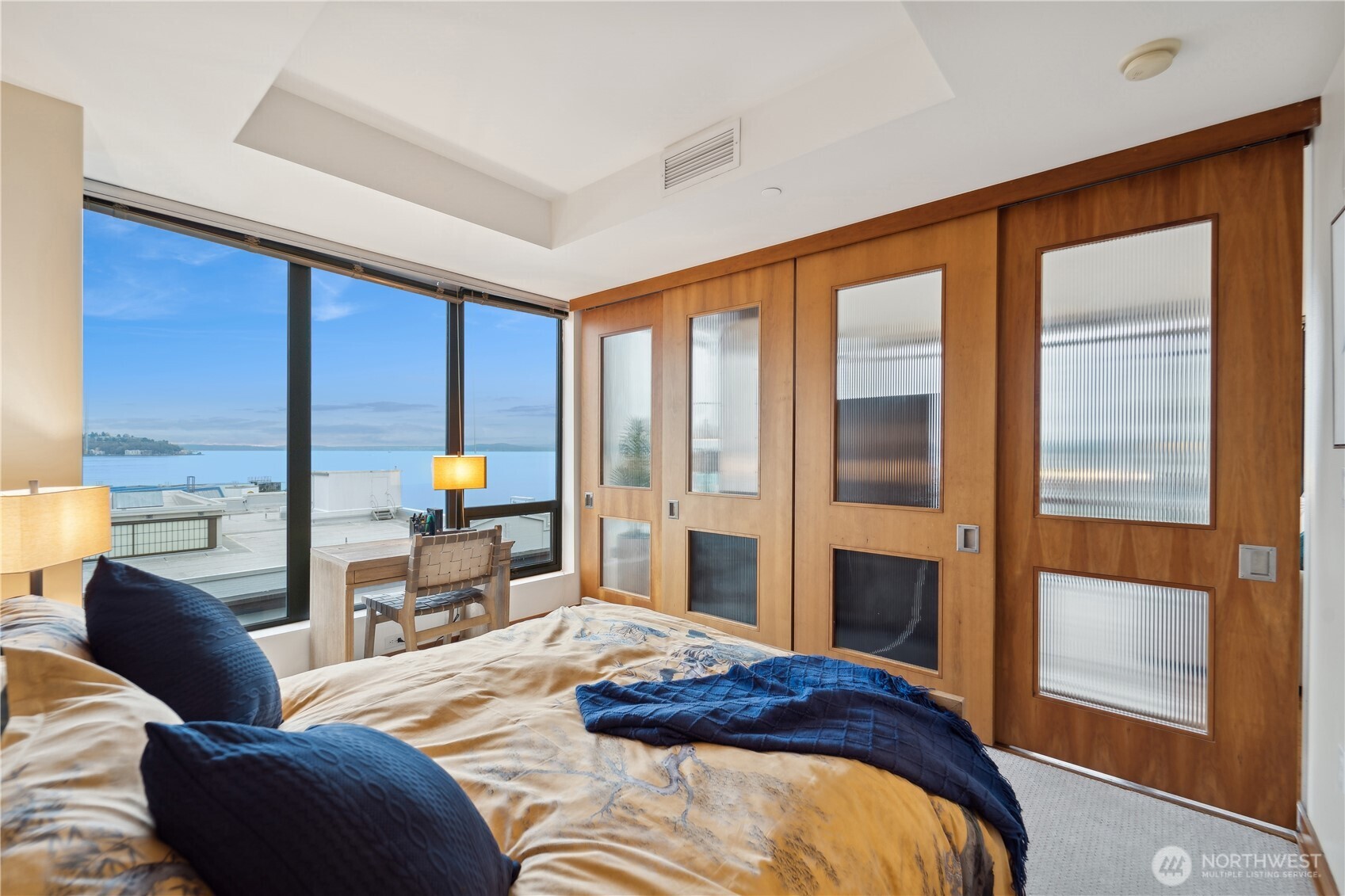 2716 Elliott Avenue, Unit 800 Seattle, WA 98121 - Photo 21 of 40 a bedroom with a large window and a bed