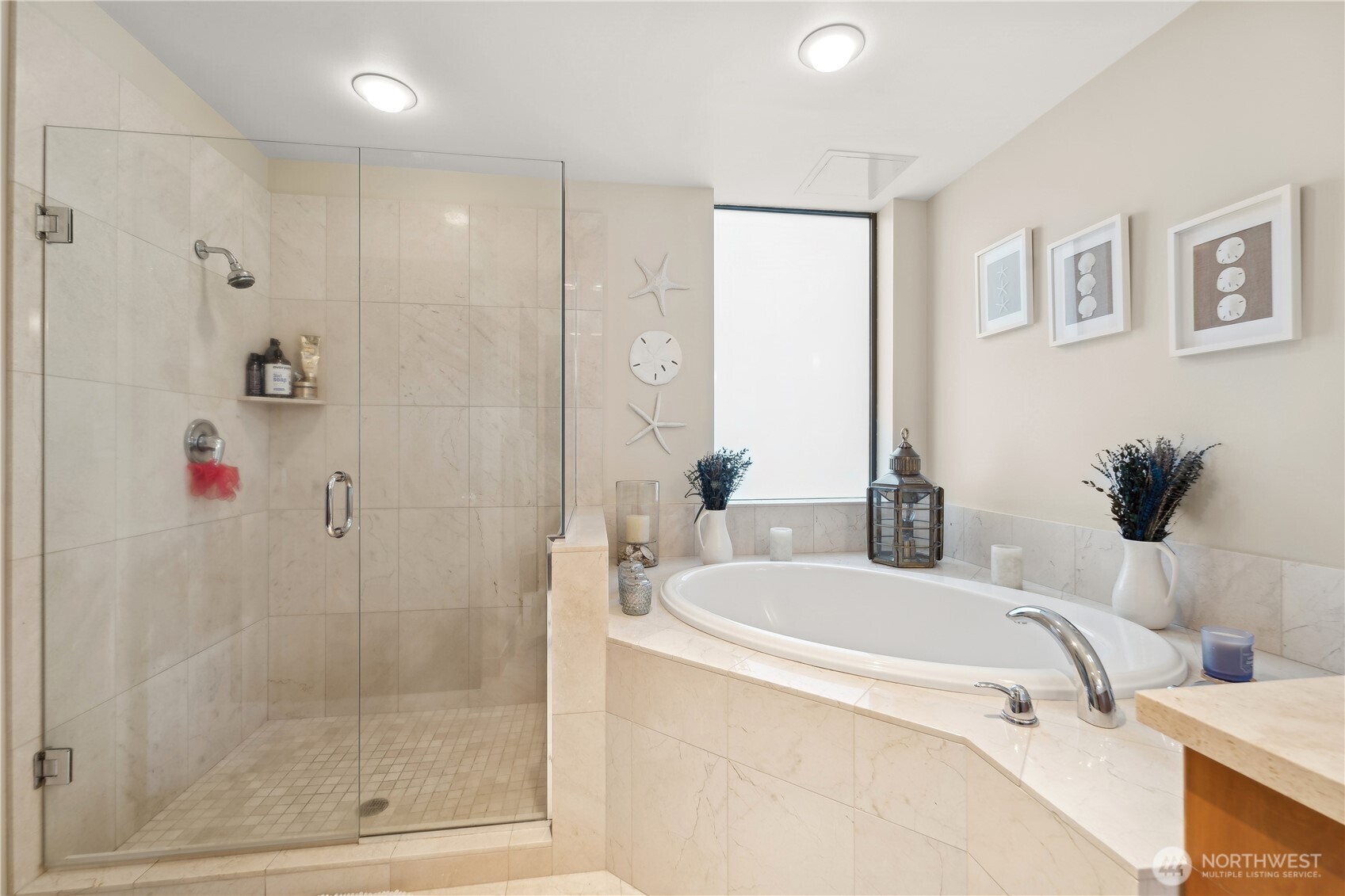 2716 Elliott Avenue, Unit 800 Seattle, WA 98121 - Photo 26 of 40 a bathroom with a tub a sink and mirror