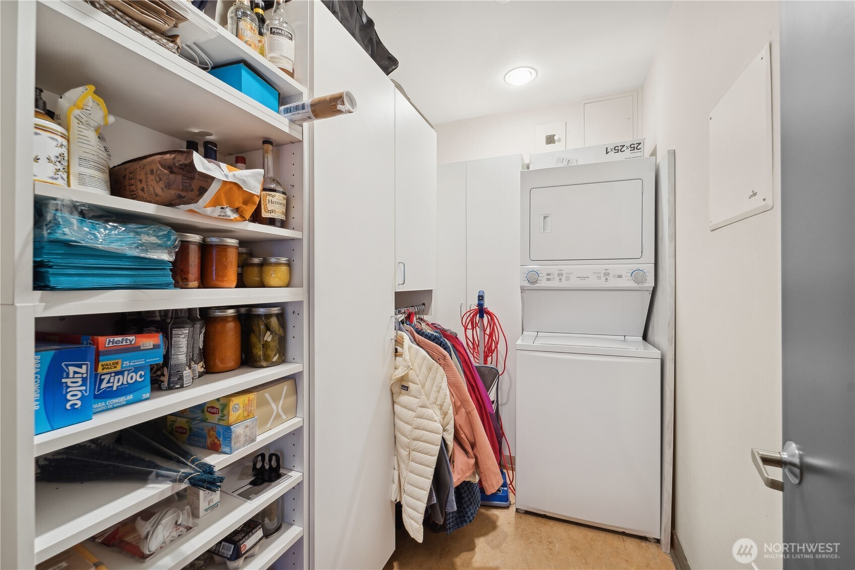 2716 Elliott Avenue, Unit 800 Seattle, WA 98121 - Photo 29 of 40 a view of walk in closet with clothes and shoes