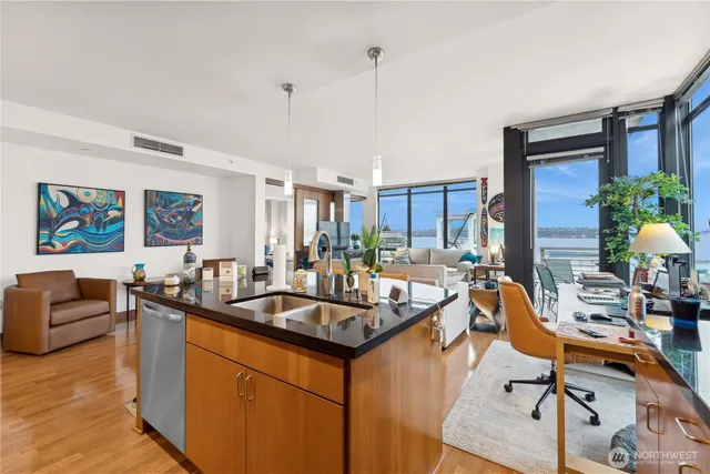 a living room with furniture a flat screen tv and a large window
