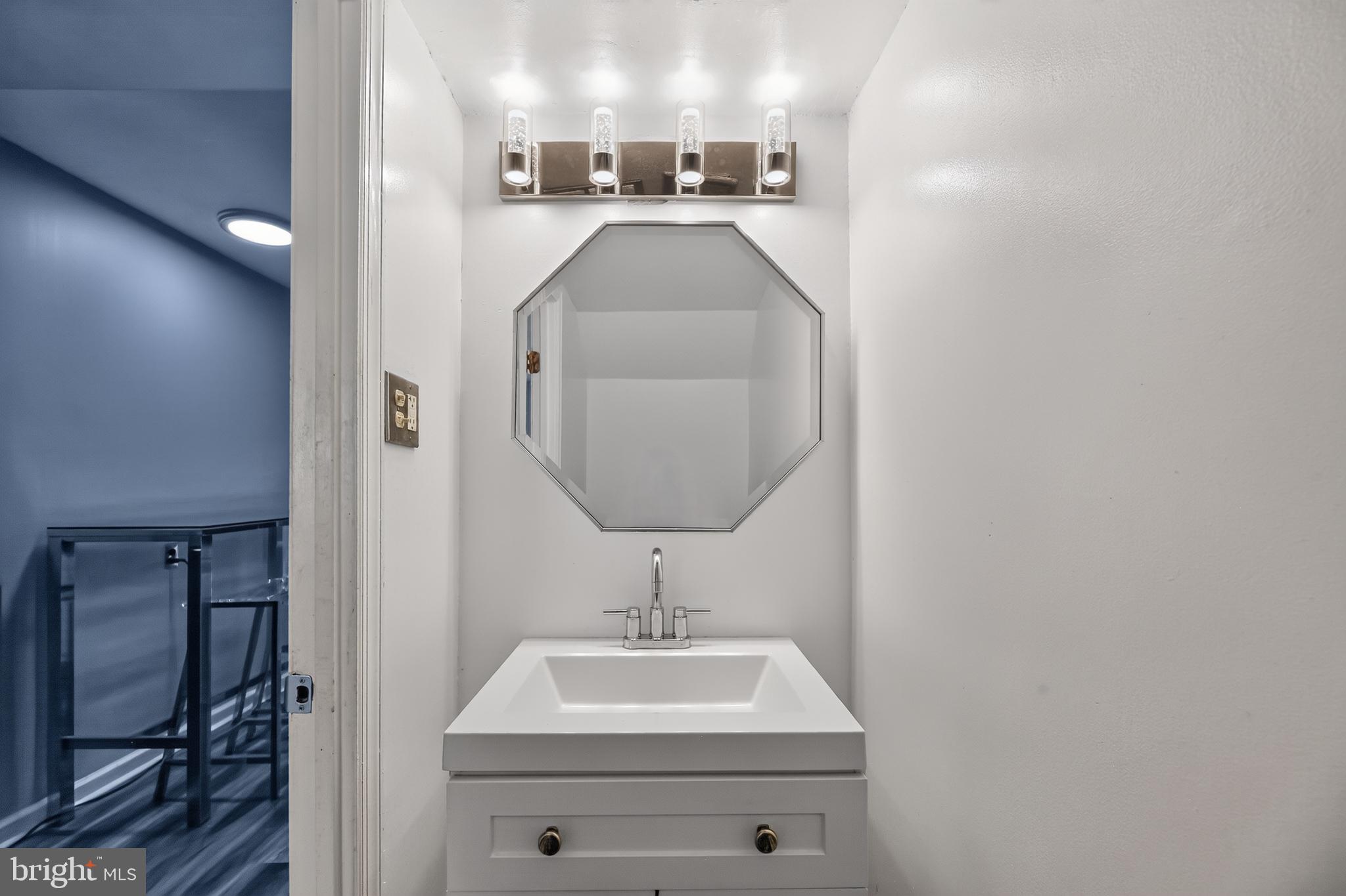 1802 Winding Way Clementon, NJ 08021 - Photo 12 of 30 a bathroom with a sink a mirror and vanity