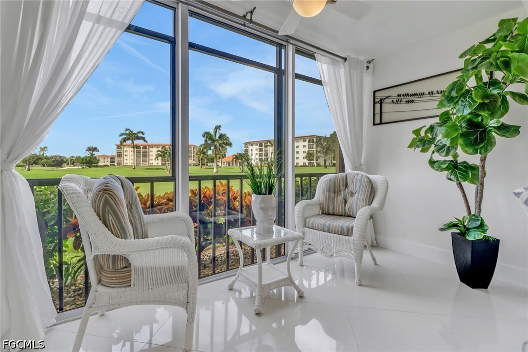9 High Point Circle North, Unit 102 Naples, FL 34103 - Photo 12 of 48 a living room filled with furniture