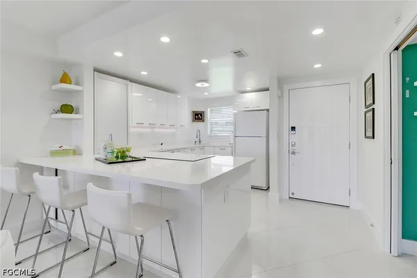 a kitchen with a sink cabinets and stainless steel appliances
