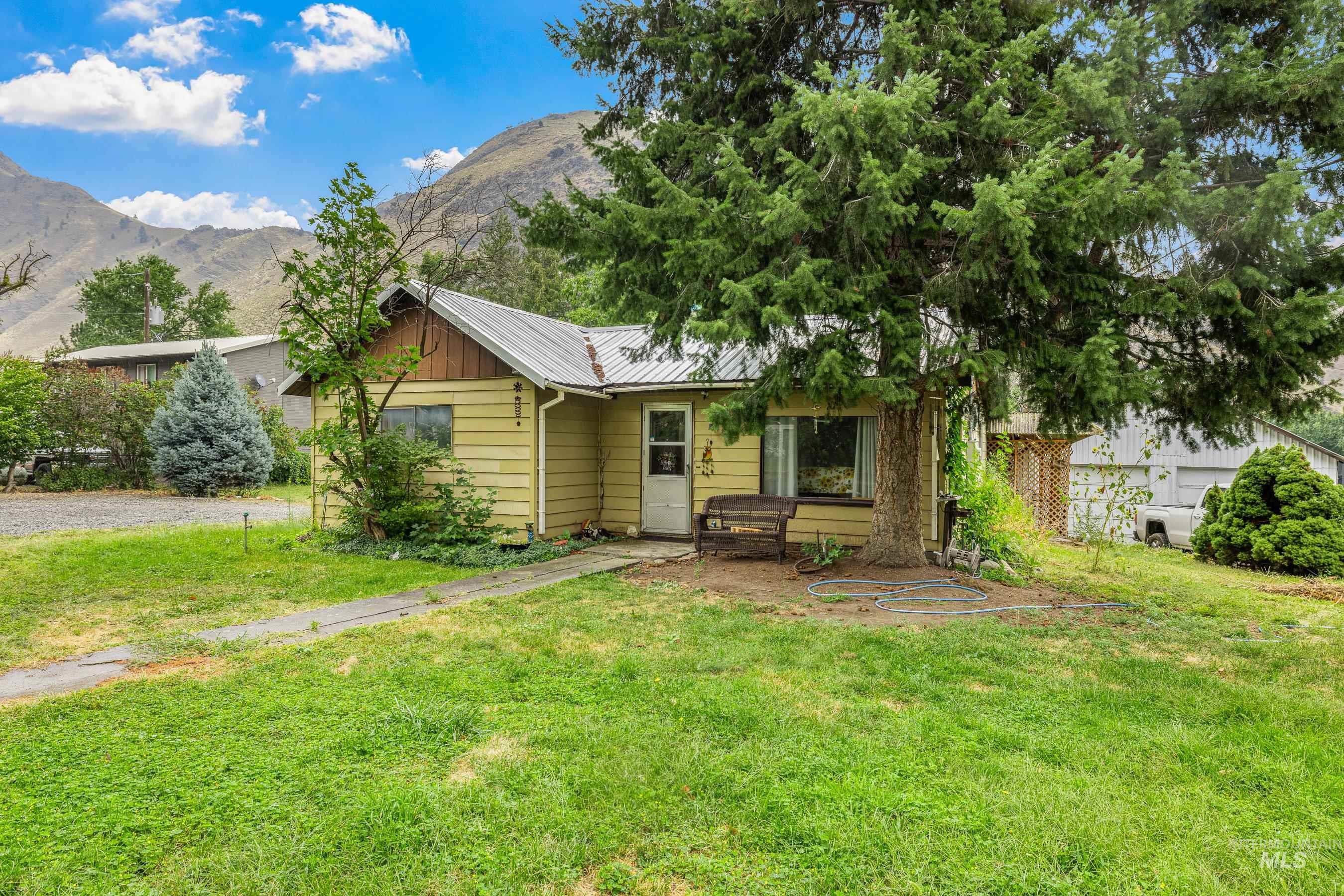 620 South Main Street Riggins, ID 83549 - Photo 15 of 23 Single-story residence with light yellow siding and a metal roof