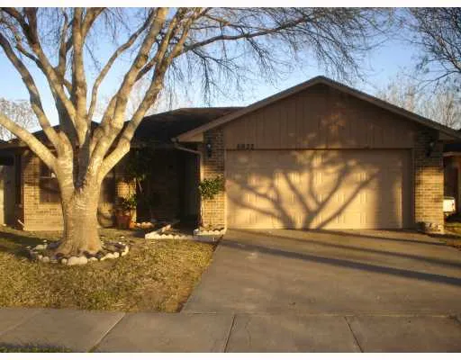 a house with trees in the background