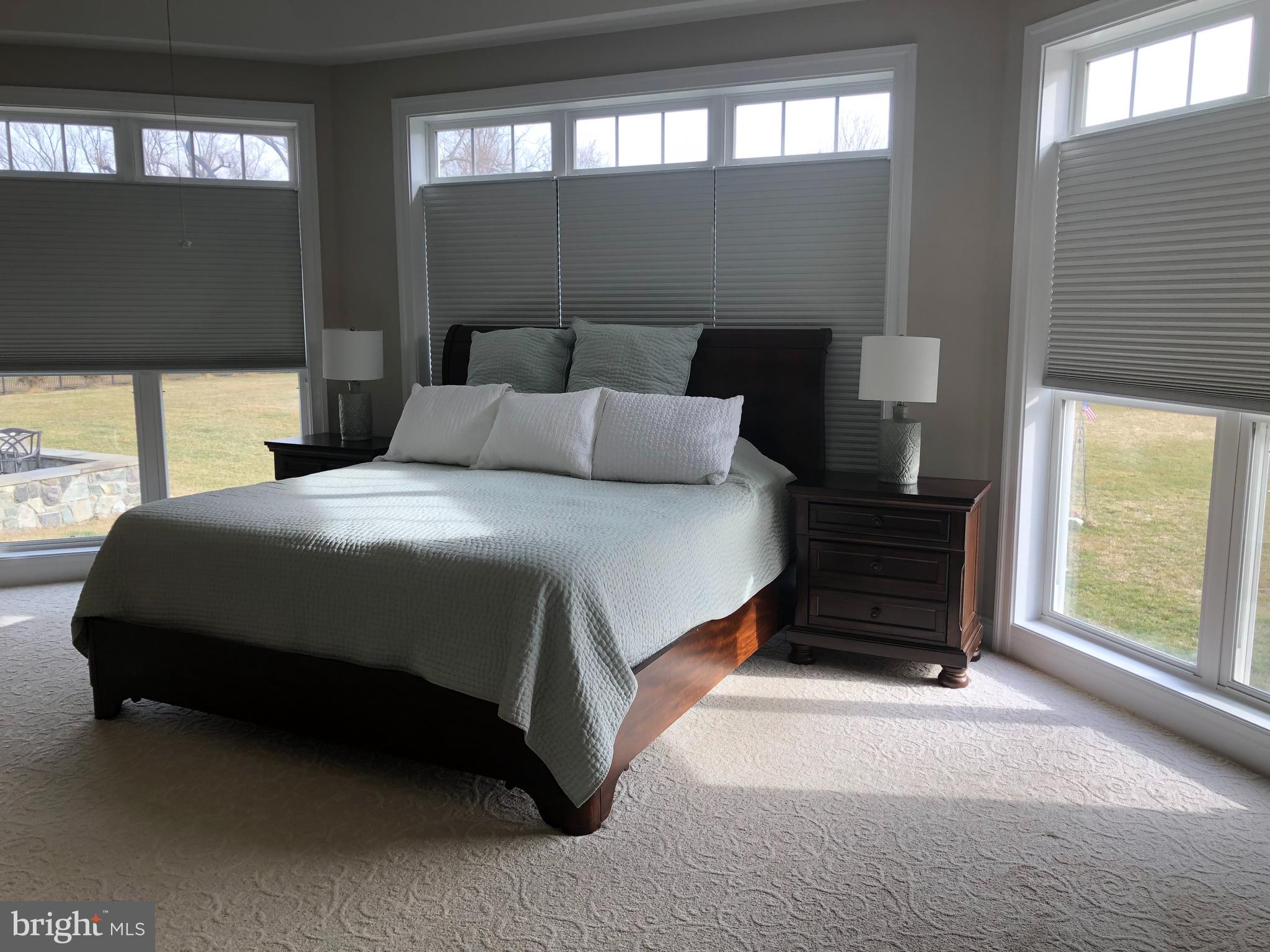 2613 Commander Davis Drive Edgewater, MD 21037 - Photo 14 of 24 a bedroom with a bed and a night stand