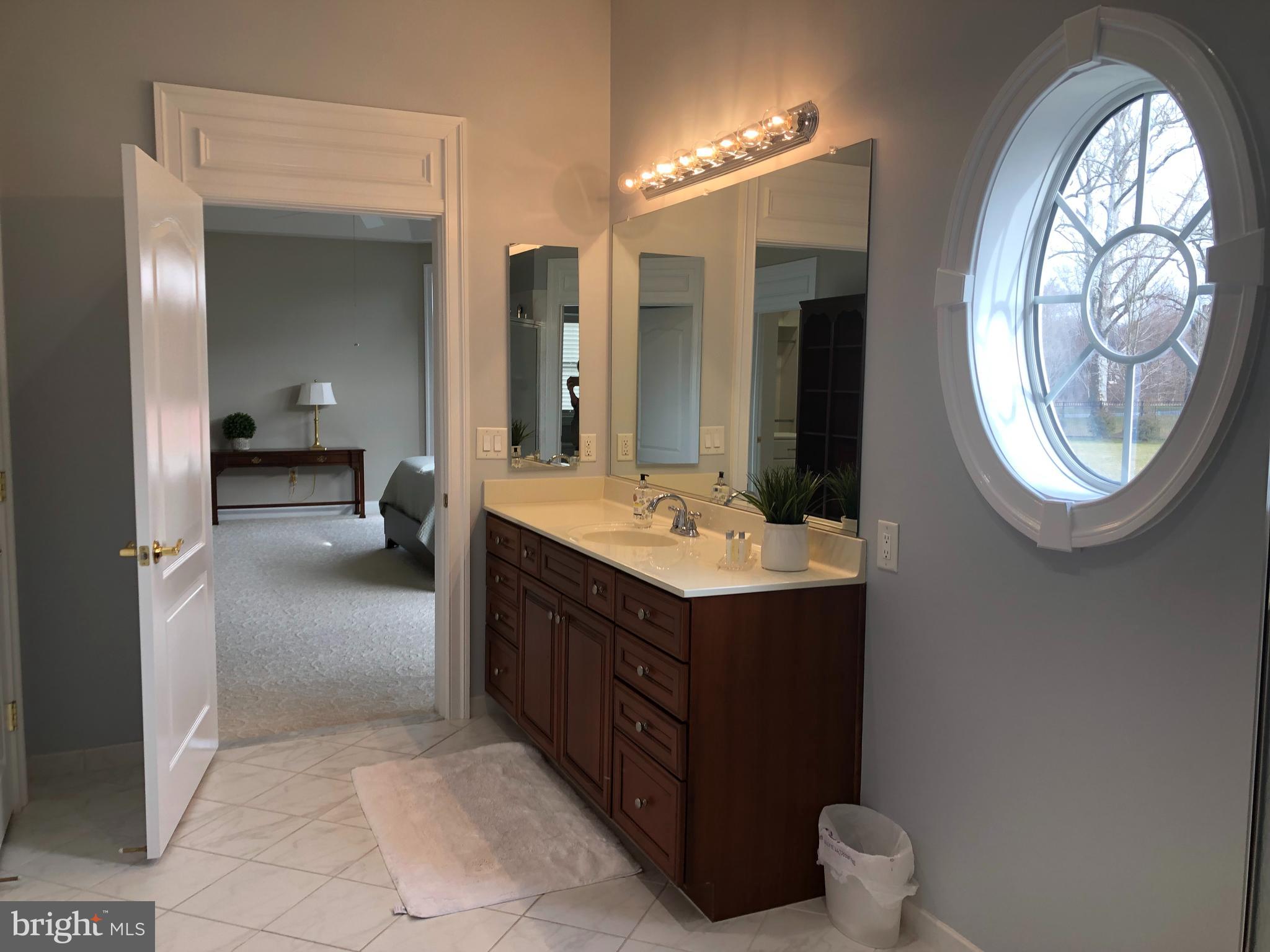 2613 Commander Davis Drive Edgewater, MD 21037 - Photo 19 of 24 a bathroom with a sink and a mirror