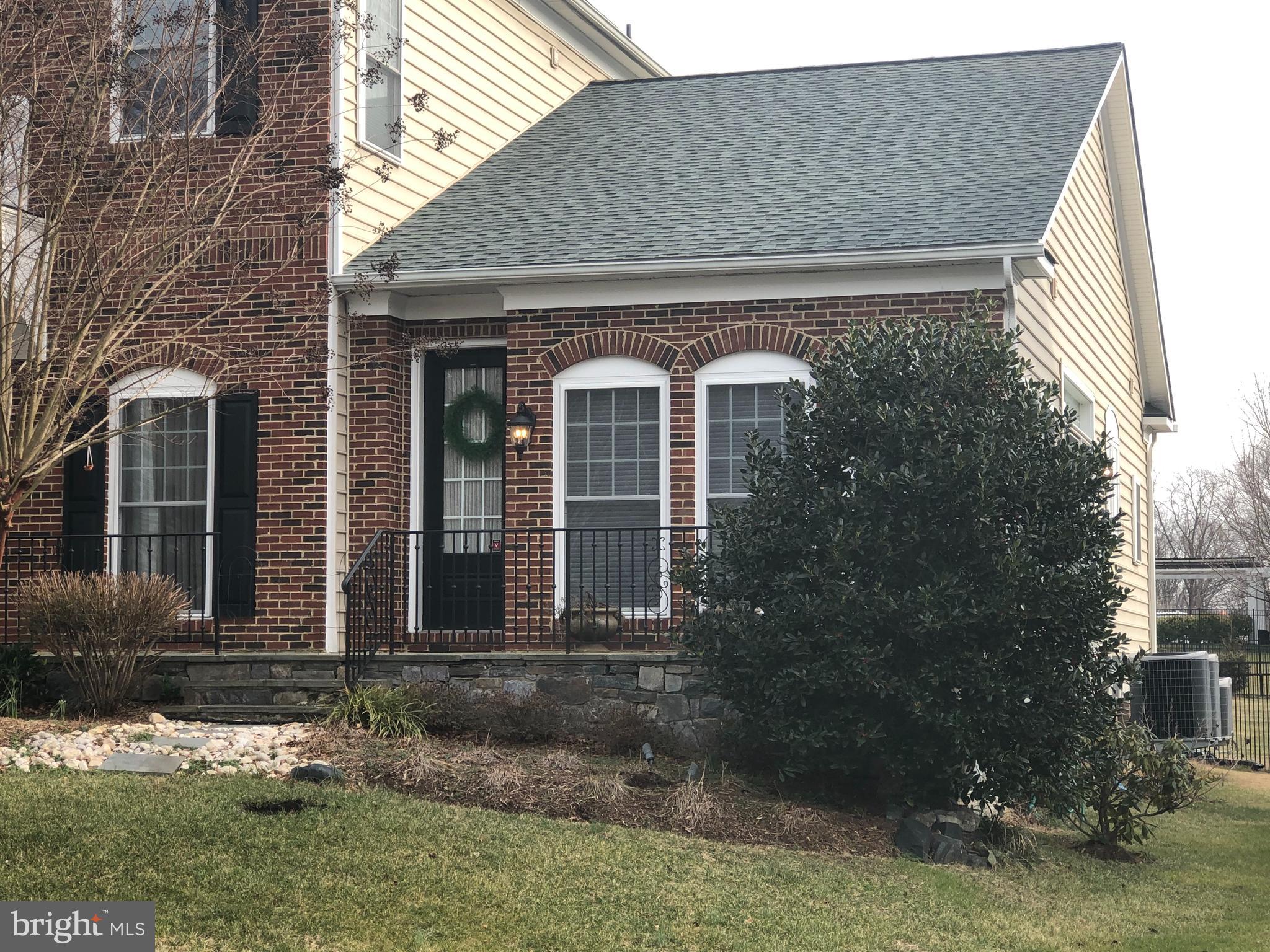 2613 Commander Davis Drive Edgewater, MD 21037 - Photo 24 of 24 a front view of a house with garden