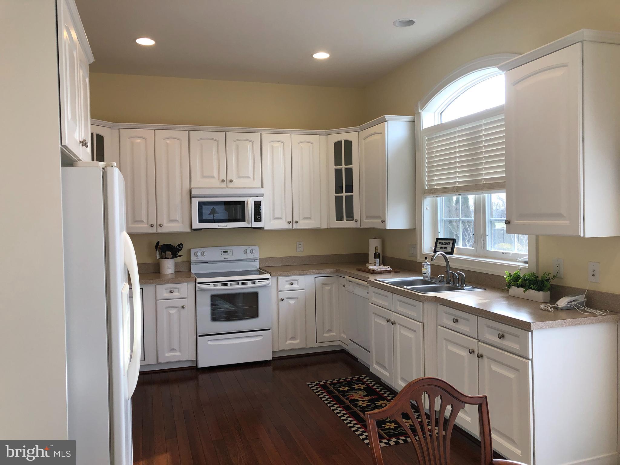 2613 Commander Davis Drive Edgewater, MD 21037 - Photo 7 of 24 a kitchen with a sink stove and microwave
