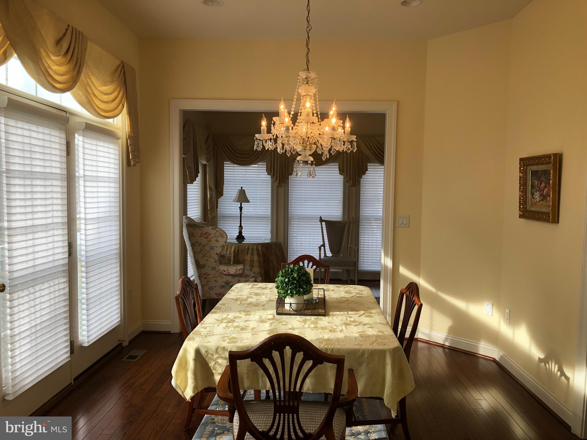 2613 Commander Davis Drive Edgewater, MD 21037 - Photo 9 of 24 a view of a dining room with furniture and wooden floor