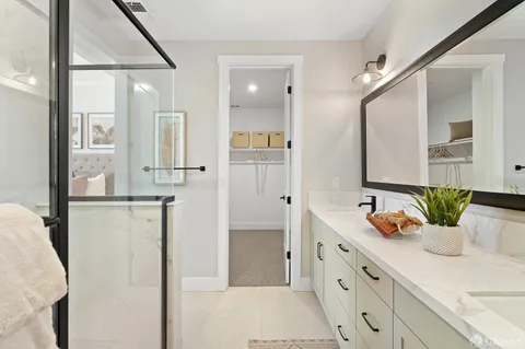 a bathroom with a double vanity sink mirror and double